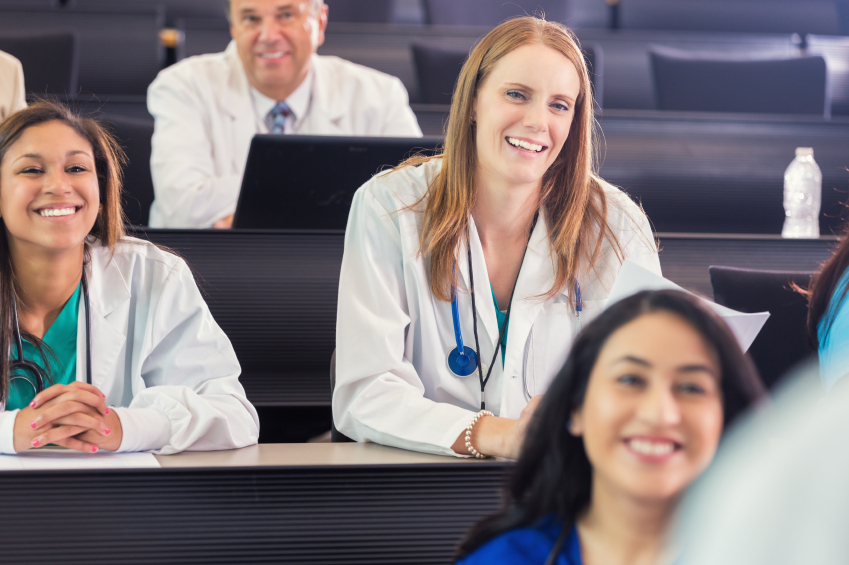 Decorative image of students in a lecture theater.